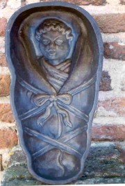 Bakvorm van gietijzer voor het bakken van wikkelkinderen. Collectie Nederlands Bakkerijmuseum.